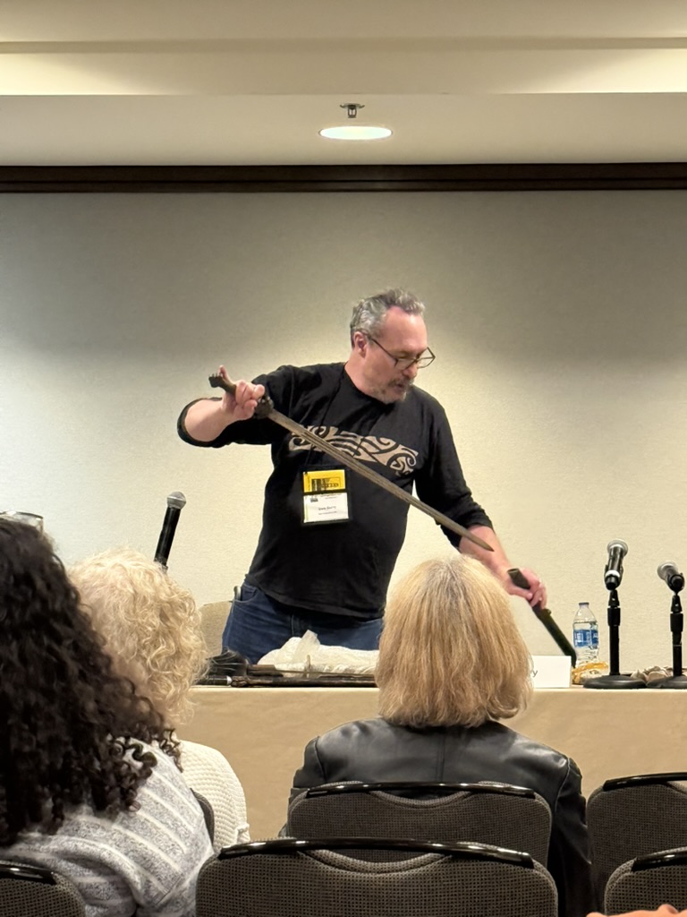 Dale holding a Qing Dynasty jian