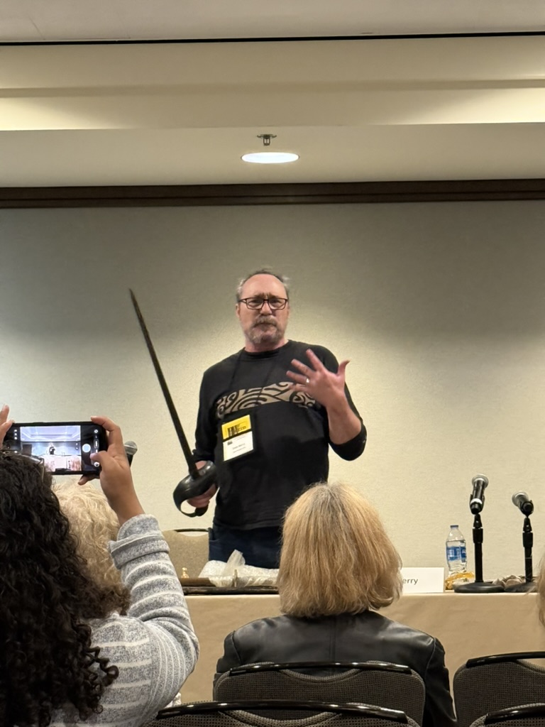 Dale holding a 1918 US cavalry saber